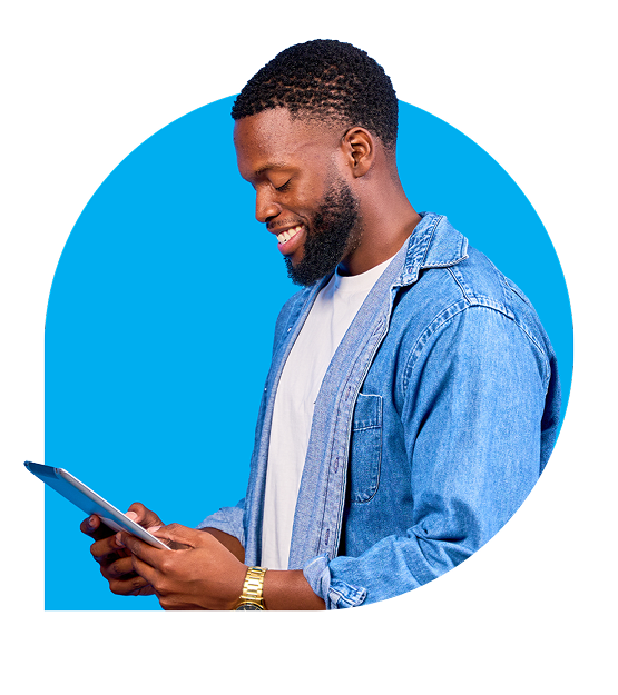 Smiling man looking at tablet